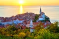 Piran Old Town, Slovenia, scenic cityscape with medieval architecture, church, sea and sky at sunset, outdoor travel background Royalty Free Stock Photo