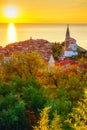 Piran Old Town, Slovenia, scenic cityscape with medieval architecture, church, sea and sky at sunset, outdoor travel background Royalty Free Stock Photo