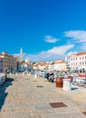 Piran Slovenia: View from Piran harbor to church tower in medieval city. Historic houses and ancient architecture in Slovenia