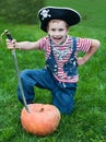 Pirate-boy and halloween pumpkin Royalty Free Stock Photo