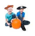 Pirate and cowboy with pumpkin - halloween theme Royalty Free Stock Photo