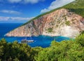 Pirate filibuster boat ship with tourists at Zakynthos blue caves Elation Sparto beach sea bay. Green sand stone rocks at Ionian S