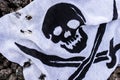 Pirate flag on the stones Royalty Free Stock Photo