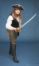 Pirate girl with sword rush to the attack on blue Royalty Free Stock Photo