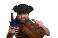 Pirate with a musket holding chest. Royalty Free Stock Photo