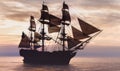 Pirate ship sailing on the ocean at sunset Royalty Free Stock Photo