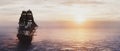 Pirate ship sailing on the ocean at sunset. Royalty Free Stock Photo