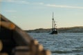 Pirate ship sailing at sunset in the sea. Wooden boat traveling on holidays Royalty Free Stock Photo