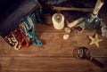 Pirate still life with a treasure chest on wooden table