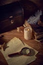 Pirate still life with a treasure chest on wooden table