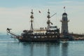 Pirate-style ships and a lighthouse off the coast of Alanya. Sea and mountains on the horizon. Alanya, Antalya district, Turkey, Royalty Free Stock Photo