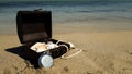 a pirate treasure chest on a sandy beach.a treasure trove of seashells, antique watches and jewelry found Royalty Free Stock Photo