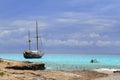 Pirates inspired wood sailboat anchored turquoise Royalty Free Stock Photo