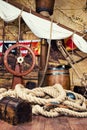 Pirates ship deck with steering wheel and flag Royalty Free Stock Photo