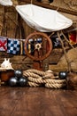 Pirates ship deck with steering wheel and flag Royalty Free Stock Photo