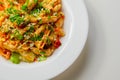 Piri piri style chicken on a bed of wholewheat pasta and vegetables, with a cool sour cream and chive dressing