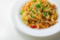Piri piri style chicken on a bed of wholewheat pasta and vegetables, with a cool sour cream and chive dressing