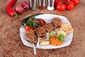 Pirzola Meat Grill Tomato and Onion on White Plate Royalty Free Stock Photo