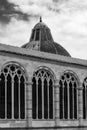 Black and white photo showing in detail windows and dome of catholic Basilica in Pisa