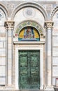 Close-up on colorful religious mosaic decorating exterior facade above door of catholic Basilica in Pisa Royalty Free Stock Photo