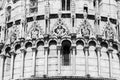 Black and white photo showing in close-up decorative statues on the exterior facade of Basilica in Pisa Royalty Free Stock Photo