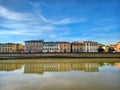 Old houses in Pisa and reflections on the water