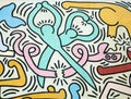 Scissors cutting a snake painted by Keith Haring