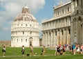 Tourists next to the Cathedral at Piazza del Duomo in Pisa, Italy