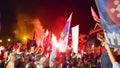 PISA, ITALY - JUNE 15TH, 2016: Local fans celebrate the soccer team\'s promotion. Celebrations in the night with smoke bombs and a Royalty Free Stock Photo