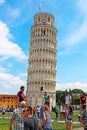 Tourists posing in front of the leaning Pisa tower in Italy - one of the most famous italian landmarks Royalty Free Stock Photo