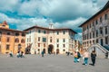 Pisa, Italy - March 18, 2023: Piazza dei Cavalieri, Palazzo della Carovana, Palazzo dell'Orologio in Pisa, Italy