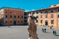 Pisa, Italy - March 18, 2023: Piazza dei Cavalieri, Palazzo della Carovana, Palazzo dell'Orologio in Pisa, Italy