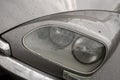 Headlight of a Citroen DS on a rainy day