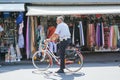 PISA, ITALY - Nov 28, 2009: An Italian policeman on a bike guards a market Royalty Free Stock Photo