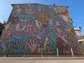 PISA, ITALY - SEPTEMBER 17, 2023 -Famous wall painting Tuttomondo from Keith Haring