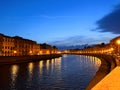 Pisa, Italy. September 16, 2023.The Ponte di Mezzo in the evening and the banks of the Arno River. The Arno River runs