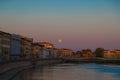Pisa\'s Twilight Serenade: Sunset Waters and Silhouetted Charm