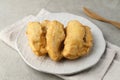 Pisang goreng or banana fritters (deep fried banana fritter with flour batter). Royalty Free Stock Photo