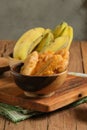 Pisang goreng or Fried Banana served on wooden table