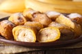 Pisang goreng fried bananas in batter on a plate macro. Horizont Royalty Free Stock Photo