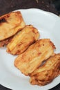 Pisang goreng or fried bananas on a white plate, Pisang goreng are fried foods that are often consumed by Indonesian people Royalty Free Stock Photo