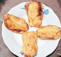 pisang goreng or fried bananas on a white plate, Pisang goreng are fried foods that are often consumed by Indonesian people Royalty Free Stock Photo