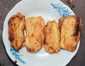 pisang goreng or fried bananas  on a white plate, Pisang goreng are fried foods that are often consumed by Indonesian people Royalty Free Stock Photo