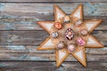 Pisanky and ethnic star frame on a wooden background. Easter eggs on a wooden table. Painted eggs for Easter holidays.