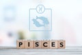 Pisces star sign on a table