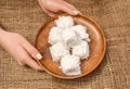 Turkish traditional dessert - Cotton Candy (Pismaniye on Turkish) on wooden plate. Rustic style. Royalty Free Stock Photo