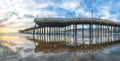 Pier that stretches toward the setting sun, panorama. An iconic California wooden pier at 1, 370 feet long in the heart of Pismo B Royalty Free Stock Photo