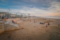 Pismo Beach at sunset. Wide sandy beach with people enjoying ocean view