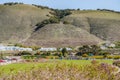 Dinosaur Caves Park, playground and walking trail, grassy lawn, green hills, and Ocean view. Park is the city`s most used event Royalty Free Stock Photo