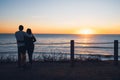 Summer romantic sunset. Couple on the beach. Royalty Free Stock Photo